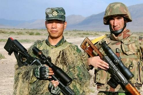 hinese and Tajik soldier posing for a photo