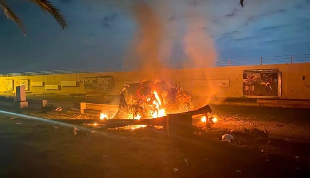 The remains of a vehicle hit by missiles outside the Baghdad airport.