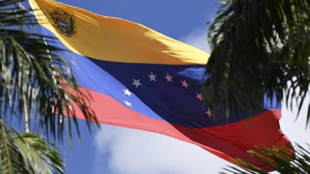 Venezuelan flag flies over the National Assembly building in Caracas