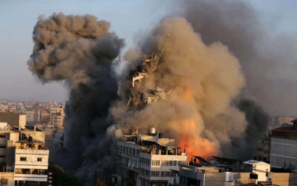 The Al-Shorouk building, which housed several news outlets, is destroyed in an Israeli airstrike in Gaza City on May 12, 2021.